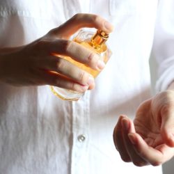 girl-uses-perfume-perfume-female-hands_441923-2708